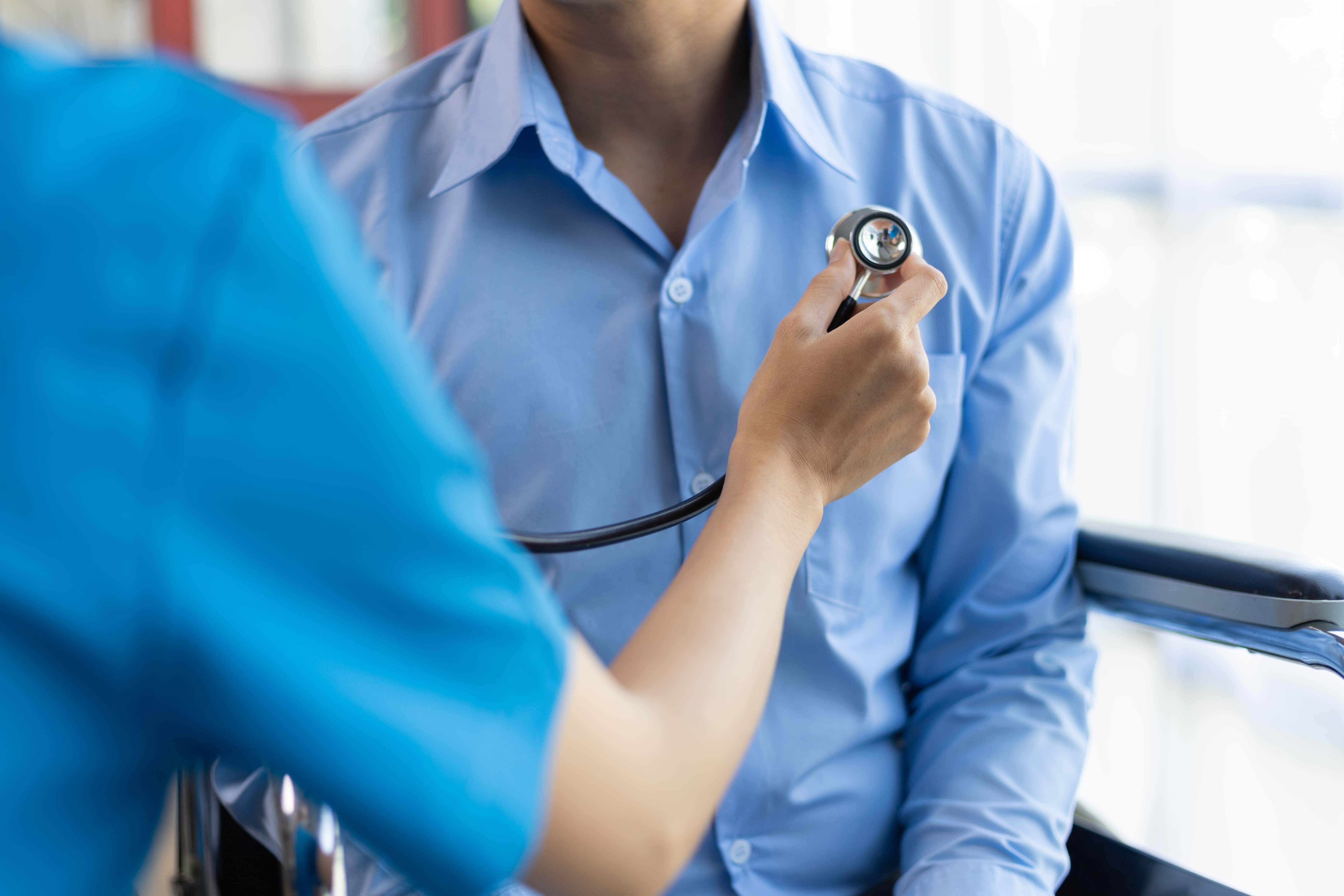 doctor-using-stethoscope-examining-patient-in-whee-2025-03-23-19-39-44-utc (1).jpg