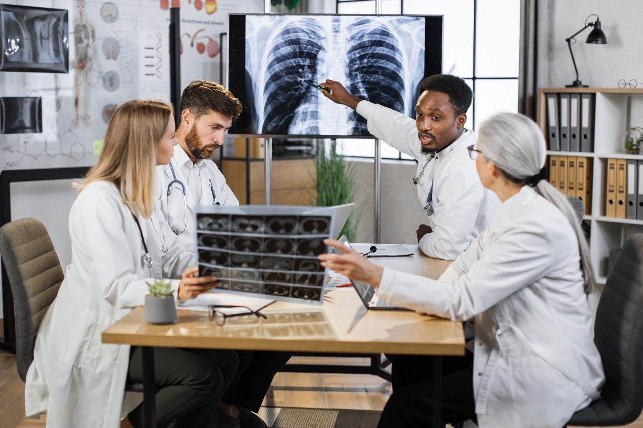 Doctor showing lung disease on display screen